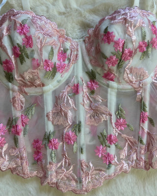 Corpetto bustier bianco con ricami floreali rosa