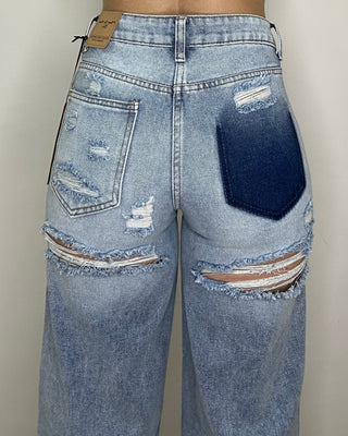 Jeans wide leg con strappi retro