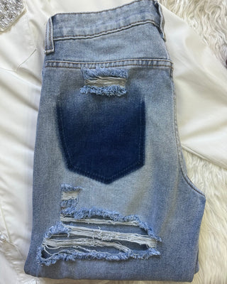Jeans wide leg con strappi retro
