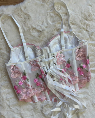 Corpetto bustier bianco con ricami floreali rosa