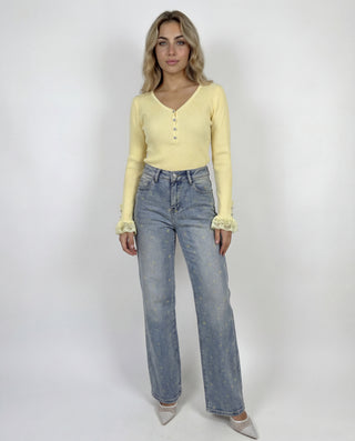 Jeans palazzo con fiorellini gialli